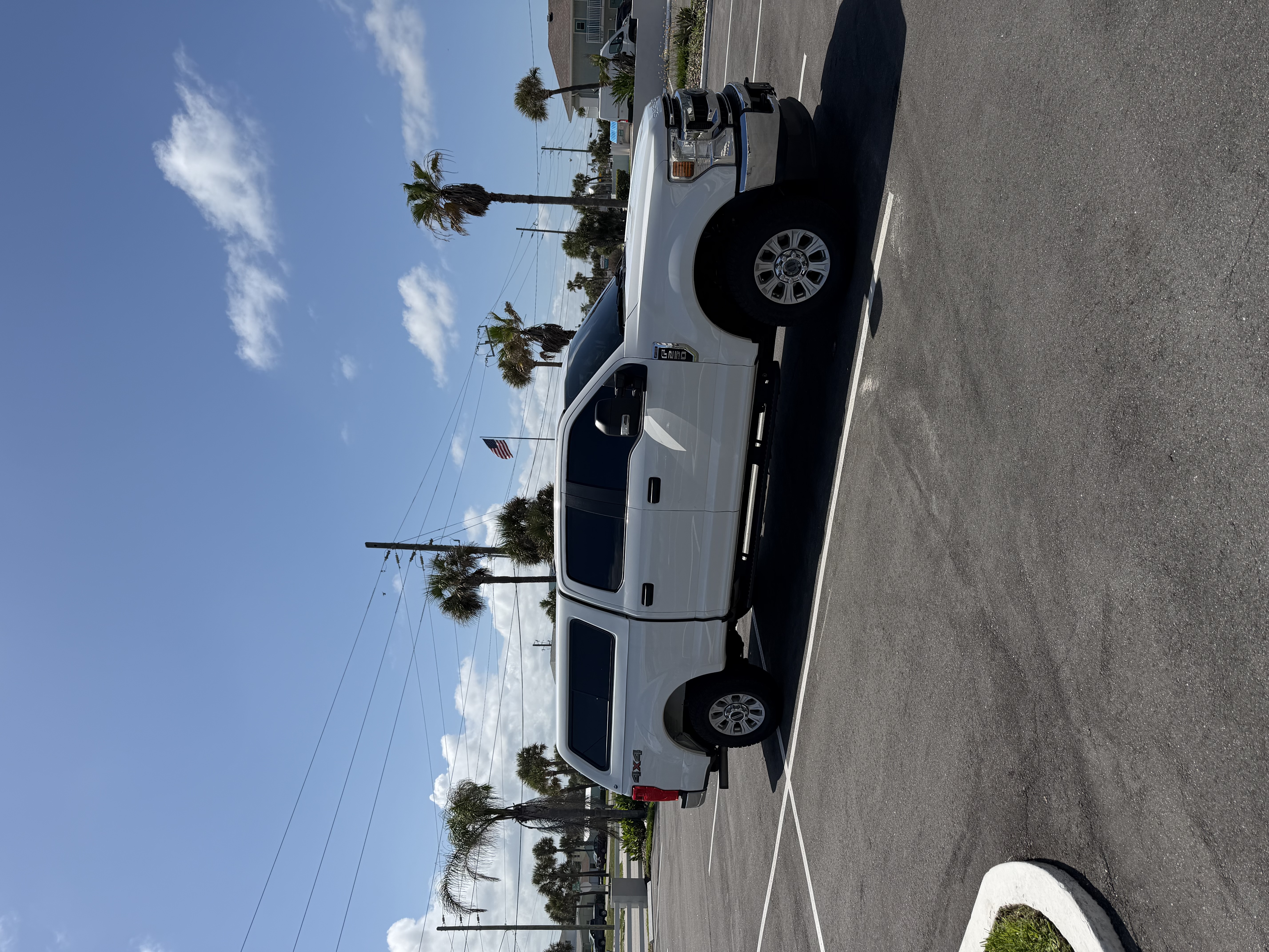 The HVAC Dude truck parked near palm trees